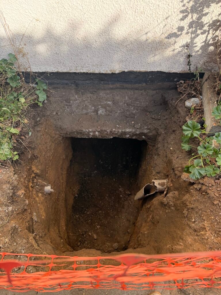 Excavation beneath existing foundations for house extension works in Norwich